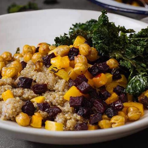 Spiced coconut quinoa with pumpkin, beetroot and kale crisps