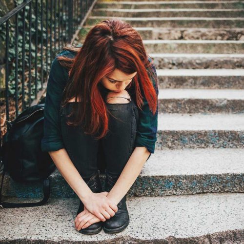 Teen girls on steps looking depressed