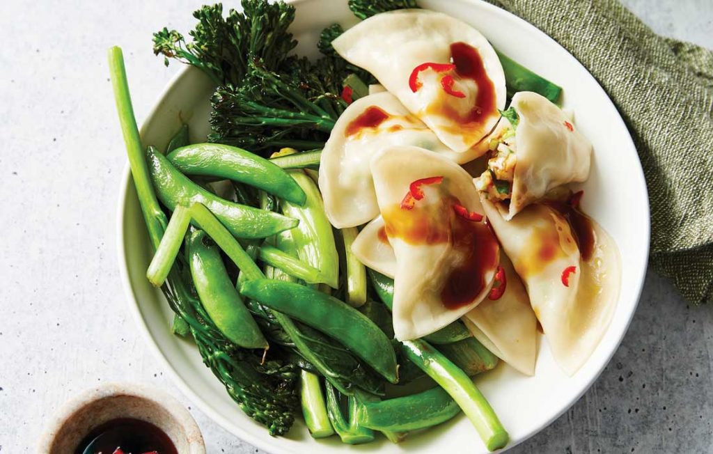 Prawn and ginger dumplings with Asian greens