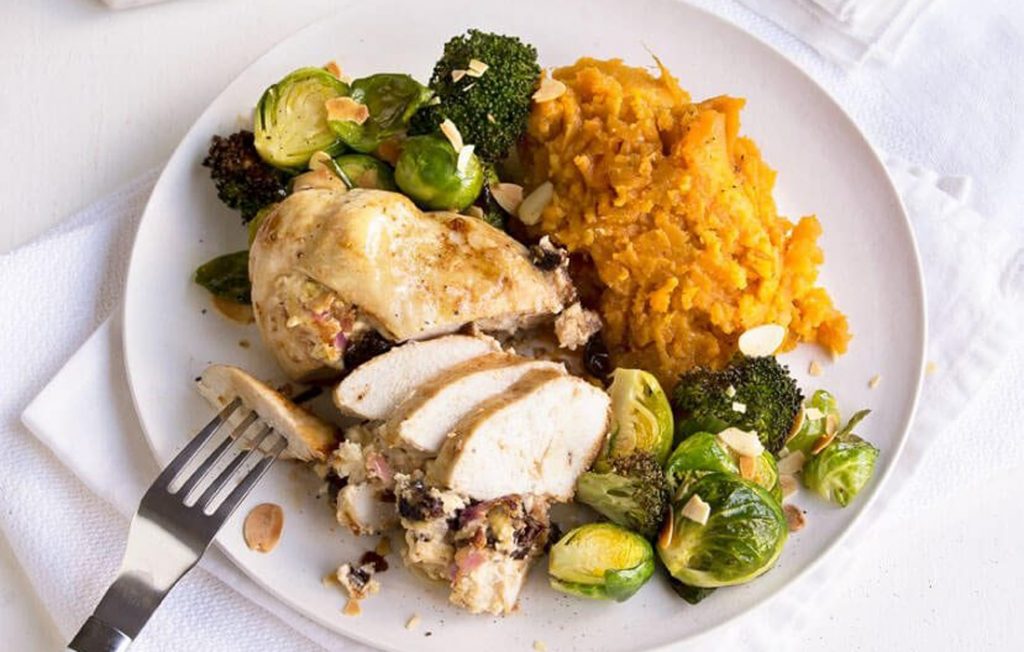 Stuffed chicken with sweet potato mash and roasted greens