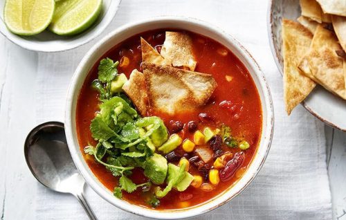 Mexican bean soup with salsa and tortilla chips