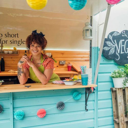 Smiling woman in a vegan food truck