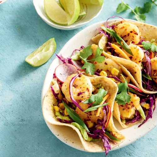 Prawn tacos with charred corn, cabbage and avocado