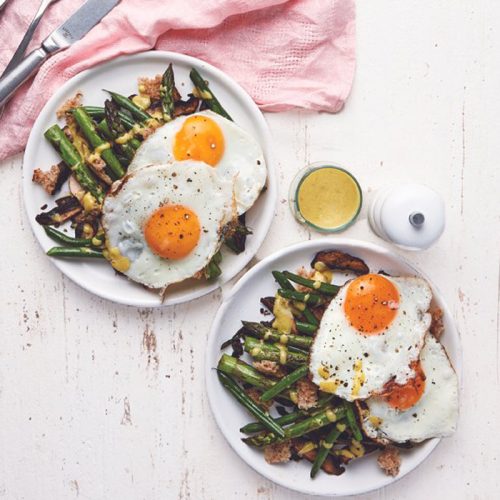 Warm fried egg and asparagus salad
