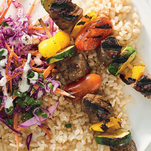 Charred vegetable and beef skewers with slaw