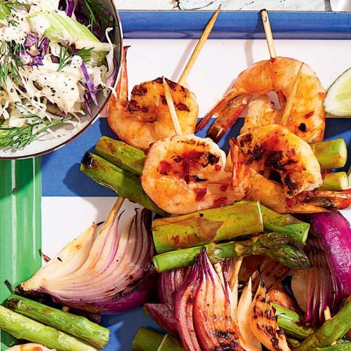Harissa prawn skewers  with dill and apple coleslaw