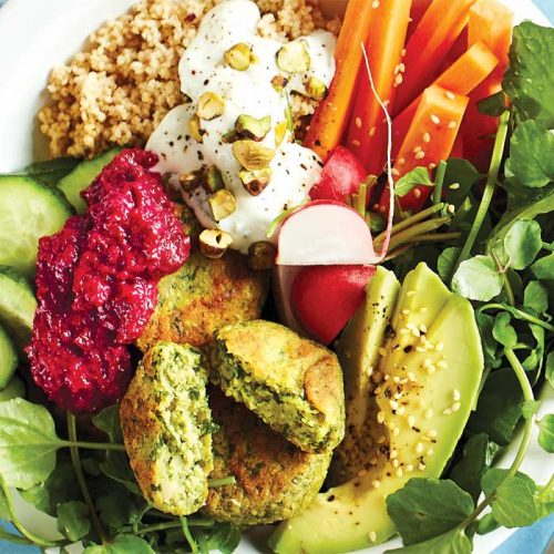 Super-green falafel bowl topped with beetroot hummus