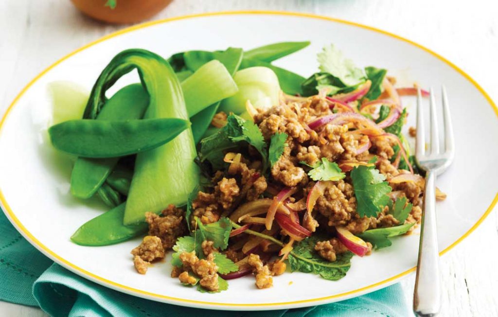 Pork larb with steamed Asian greens