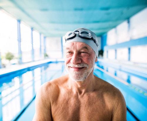 Healthy older man at a swimming pool