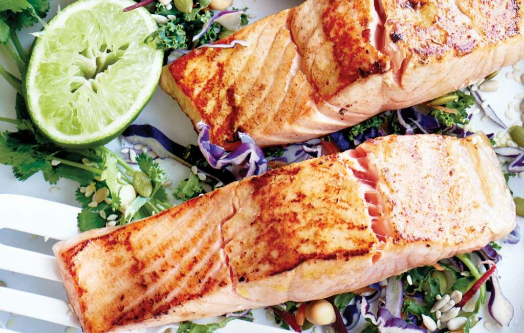 Barbecued salmon and kalesaw with honey and lime dressing