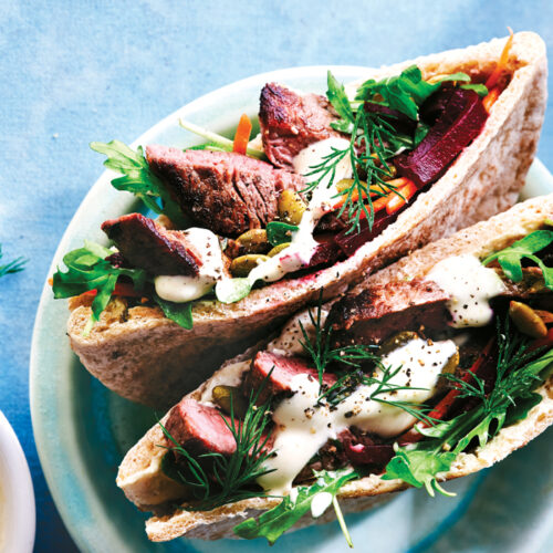 Pita pockets with seared beef and beetroot and pumpkin seed salad