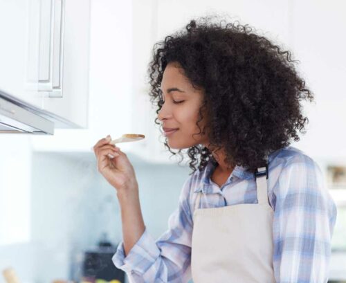 Woman smelling cooking