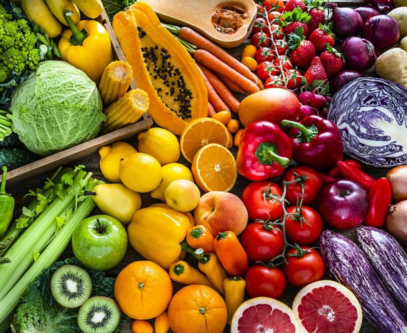 Healthy fresh rainbow colored fruits and vegetables background