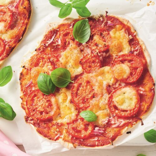 Margherita pizza with tomato salad