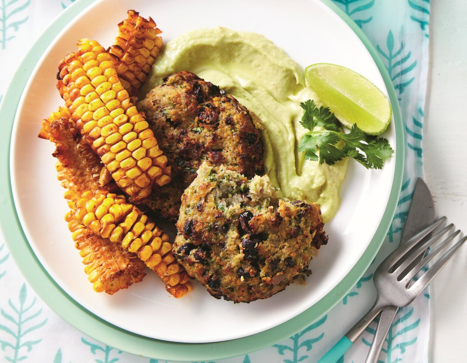 Air-fryer fish cakes with smoky corn ribs and avocado sauce  