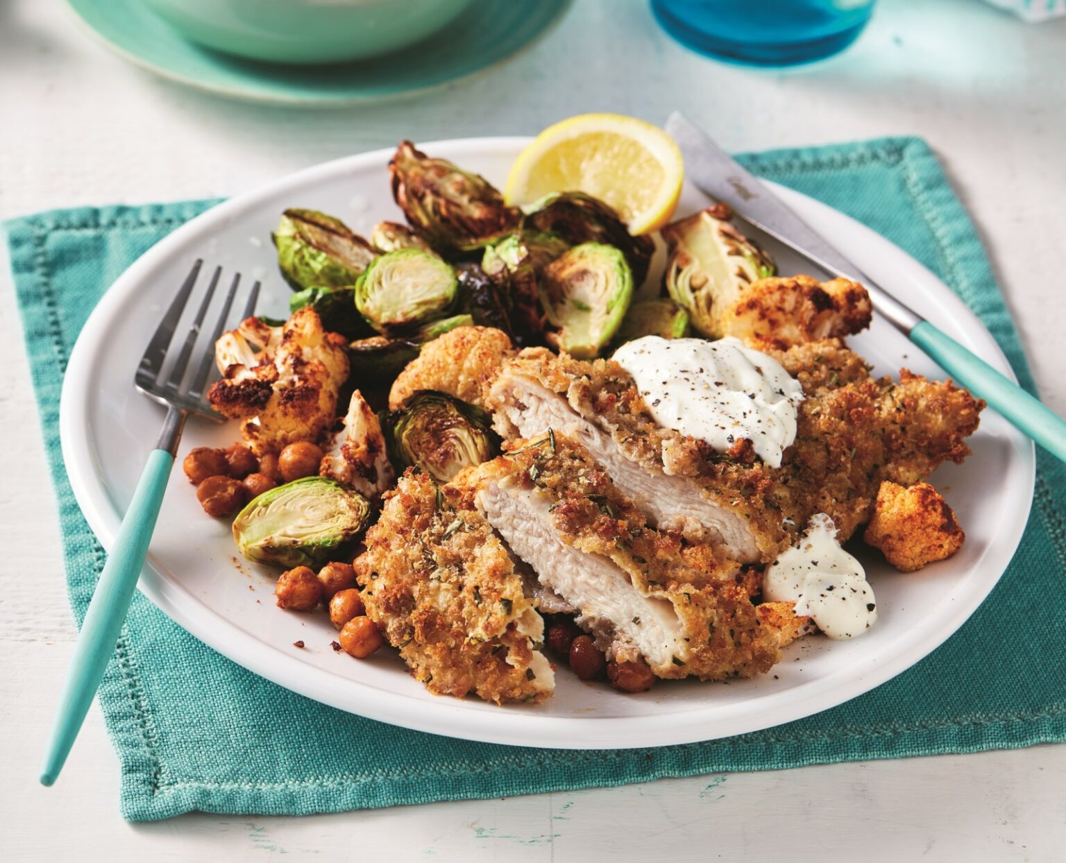 Air-fryer rosemary and rye crumbed chicken schnitzel with crispy Brussels sprouts