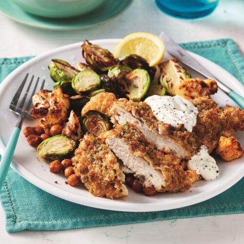 Air-fryer rosemary and rye crumbed chicken schnitzel with crispy Brussels sprouts